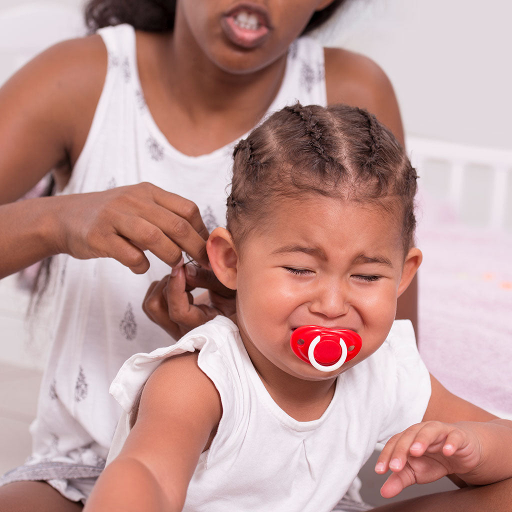 5 Hairstyles That Cause Major Damage To Your Child's Curly Hair